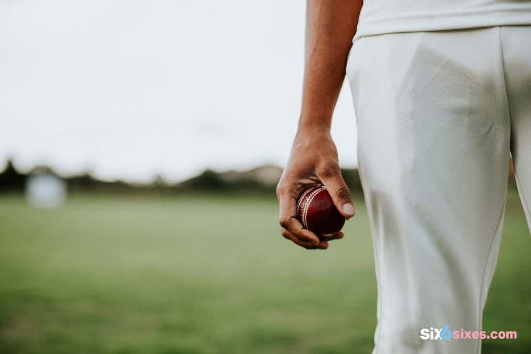 cricket-player-holding-leather-ball